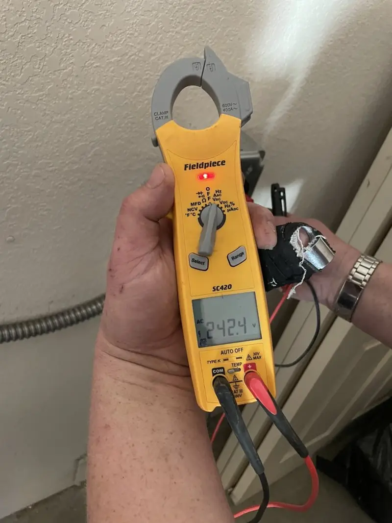 Voltage testing with clamp meter during Recessed Lighting Installation in Middletown